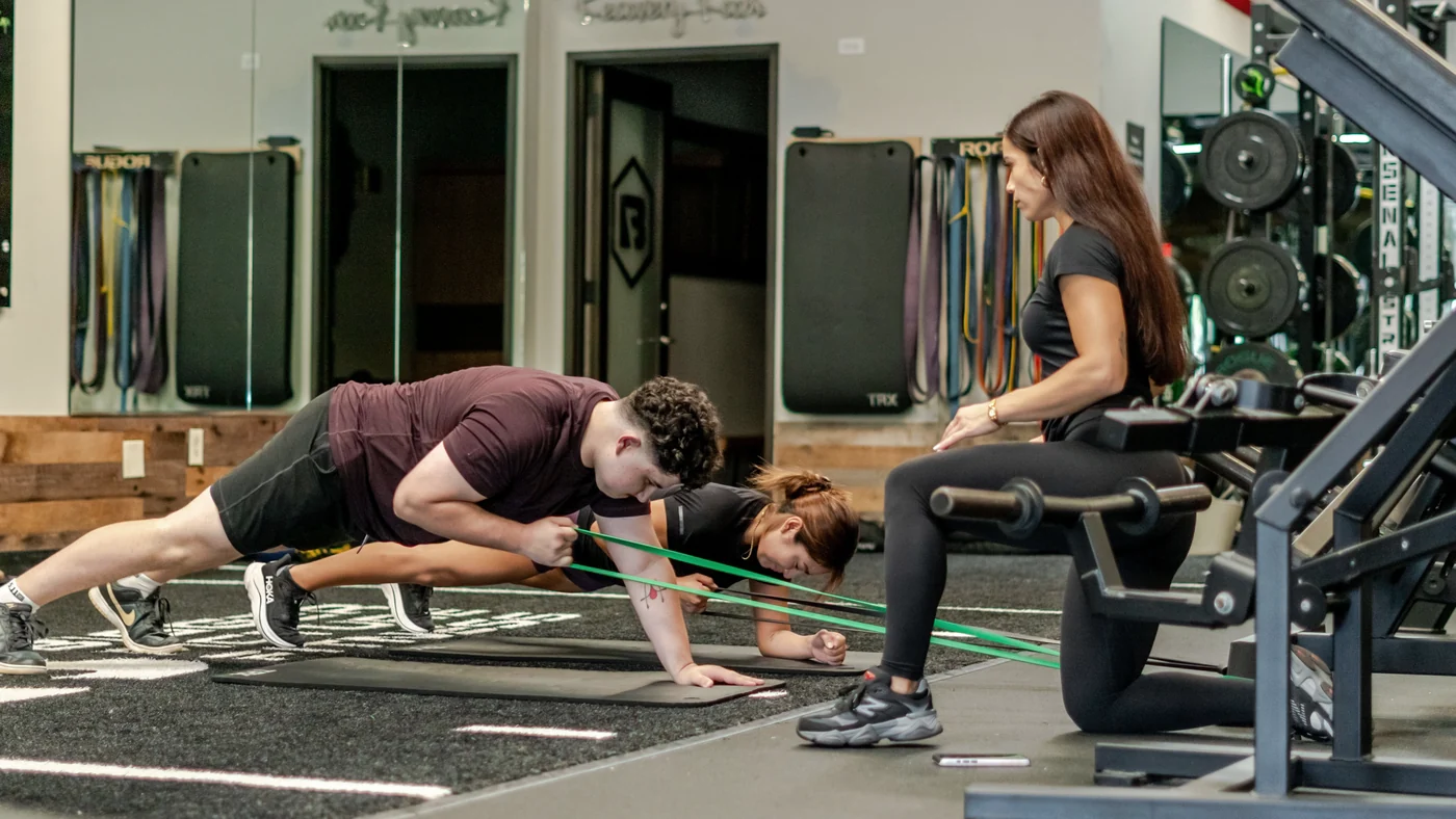 Kayla coaching a client
