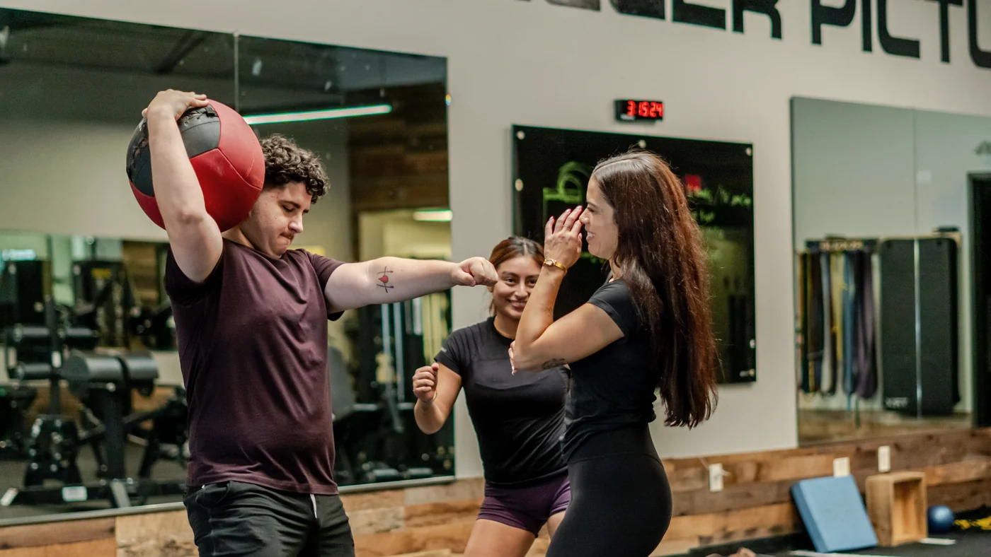 Kayla coaching a client